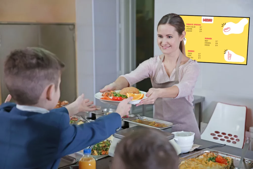 pleasant woman giving lunch school boy cafeteria